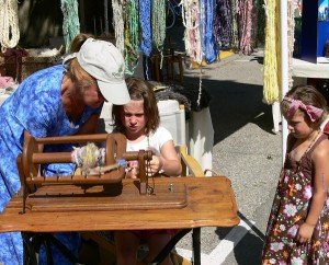 children learning to spin, teaching fibre arts