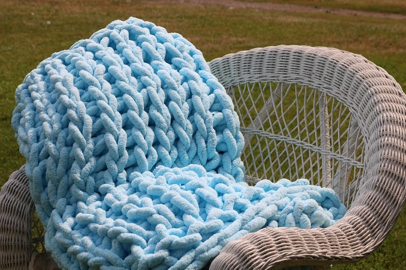 soft blue henille blanket on chair